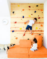 Watch and learn how to build one for a fraction of the cost! Using The Nugget As The Landing Pad For Your Diy Rock Climbing Wal Creative Kids Rooms Climbing Wall Kids Kids Wall Decor