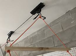 With pulley system on the ceiling, you can lift the heavy bikes above your head easily. How To Make A Diy Garage Ceiling Pulley Lift System For A Thule Ski Cargo Box