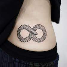Family designs here, a family is written in a simple infinity sign in dark ink to the sides of the wearer's wrist. 1001 Ideas For A Beautiful Ouroboros Tattoo And The Meaning Behind It