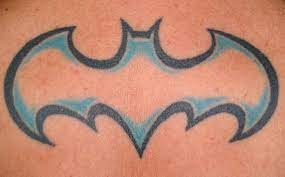 Half of it is the symbol that suggests the wings of a bat, while the other half is an actual bat, somehow disintegrating over the. Batman Symbol Tattoo By Piczeels On Deviantart Batman Symbol Tattoos Batman Tattoo Symbol Tattoos