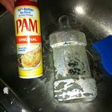 Gently rub at the sticky spot with your cloth until the gunk comes up. Pam Removes Sticker Residue From Plastic Bottles Very Well Spray It Down Wait And You Could See The Res Remove Sticker Residue Sticker Removal Cleaning Hacks