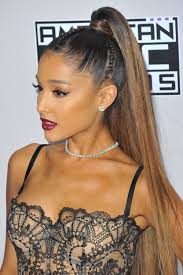 Natural curls pulled back into a ponytail. Signature Celebrity Hairstyles To Inspire Your Wedding Day Look High Ponytail Hairstyles Hair Styles Long Hair Styles