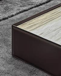 Marble, a material of timeless appeal, inspired the concept of a collection of accent tables displaying an unconventional elegance, versatility in placement and variety in finishes, available in many shapes and sizes. Side Coffee Tables En