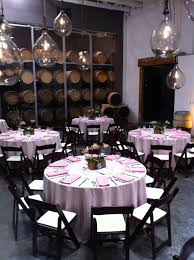 Wedding With Champagne Linens And Mahogany Wood Folding Chairs At Bluxome Street Winery Wood Folding Chair Folding Chair Covers Table Decorations