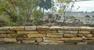 I used to do stone work in high school. Flagstone Retaining Wall How To Dry Stacked Flagstone Wall Stone Walls Garden Stone Decor Flagstone Garden