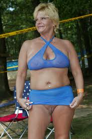 Almost nude mature lady in her transparent bikini showing her boobs and  bottomless pussy