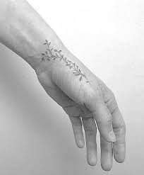 You Just Have To Say That You Re Fine Vine Flowers And Vines On The Left Hand Wrap Around Wrist Tattoos Hand Tattoos For Women Hand Tattoos