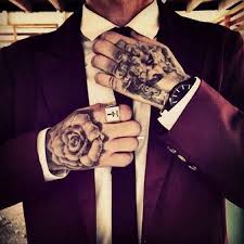 A creative hand tattoo idea would be to have a portrait tattoo but remember it might fade away sooner than later. Men Hand Tattoos Suits And Tattoos Hand Tattoos Hand Tattoos For Guys