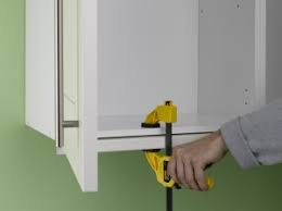 fitting kitchen unit cornice and pelmet