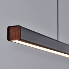 Linear Light Fixture With Wrapped Metal And Wood Detail Linear Pendant Lighting Modern Lighting Design Linear Lighting