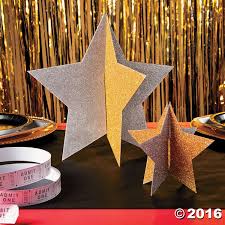 Golden stars with confetti and serpentine. Gold Silver Star Centerpieces Star Centerpieces Star Theme Party Star Party