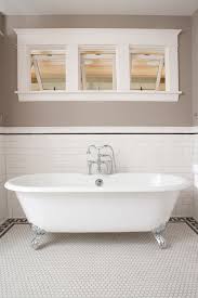A thirty six inch height also means the rail will be interrupted by the vanity so if you use a top molding thats thicker than the typical 3/4 backsplash you have to 45 it back or return it which again looks funny to my eye. Bathroom Tile Wainscot Height