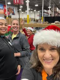 Tomi, Kiki, Rita and Connie from our leadership team spent a couple days up  to our elbows in shoe boxes at the Operation Christmas Child Processing  Center near Chicago! What a blast