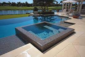 For the hot tub, there is a pump, heater, air jets, benches, and a cover. 11 Awesome Jacuzzi Pools For Your Home Awesome 11 Pool Hot Tub Swimming Pools Pool Designs