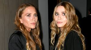 Ashley rocked a slinky black. Mary Kate And Ashley Olsen Lean On Each Other At Airport In Cutest Twin Moment Ever Entertainment Tonight