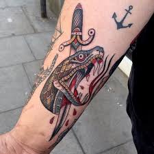 We did not find results for: New School Style Colored Arm Tattoo Of Big Bloody Snake Head With Dagger Tattooimages Biz