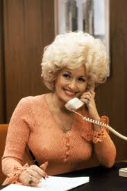 Tight blue jeans, a knotted plaid shirt and hair worn. In 1980 Dolly Parton Had Big Bouncy Hair Dolly Parton Has Been A Blond Bombshell For 73 Years And We Have Proof Popsugar Beauty Photo 3