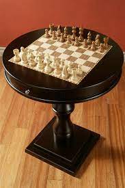 A table is an item of furniture with a flat top and one or more legs, used as a surface for working at, eating from or on which to place things. I Will Have A Chess Table In My House One Day Love This One Chess Table Table Table Games