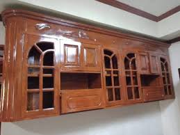 Hold each lid up to the cabinet door and place command hooks at 8:00 and 4:00 (pretending your lid is a clock face). Narra Wood Hanging Cabinet Furniture Home Living Furniture Shelves Cabinets Racks On Carousell