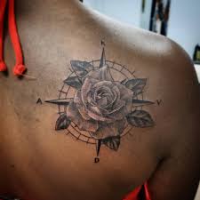3d tattoo with combination of compass, rose and candle. 135 Awesome Compass Tattoos And Their Meanings Tattoo Ideas