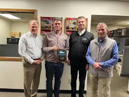 Derek Scholten and André Boutin had a great visit with our friends at the  Tiger Mowers factory! We are thrilled to have received a plaque for  Outstanding Sales by Tiger's President Shawn