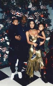 Stormi is not facing the camera. Kim Kardashian Sports Lip Ring During Family Christmas Party E Online Uk