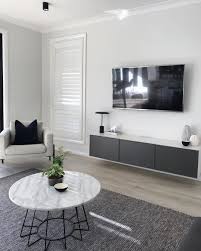 The white sectional dominates the space near the window. 15 Minimalist Living Rooms With Maximal Style