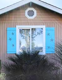 Window shutters aren't just a decorative detail—functional shutters can be an incredibly useful addition for your home. Decorative Coastal Window Shutters For Curb Appeal Coastal Decor Ideas Interior Design Diy Shopping