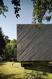 House Extension By Franz Architekten Clad With Diagonal Larch Strips Architecture Exterior Facade Architecture Timber Architecture