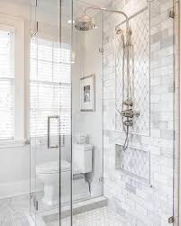 Elevate a basic color scheme with an intricate design to capture the eye; These 20 Tile Shower Ideas Will Have You Planning Your Bathroom Redo