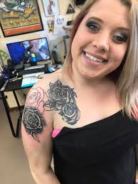 Who can add a rosary to a sleeve tattoo in NE Ohio?