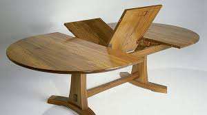 A circular dining table that expands when rotated. A Butterfly Expansion Table Finewoodworking