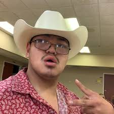 Who owns a early 2000s white Impala 4 door with blue decals