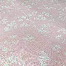 In the example below it's the pink flower with the large yellow center. Kew Floral Fabric Pink Ian Mankin