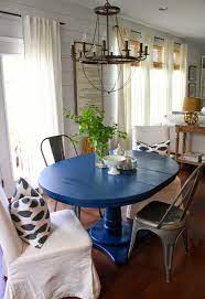 Blue is arguably the most popular color in the world of interior design and is a favorite in relaxing bathrooms, cozy bedrooms, elegant living rooms and even trendy kitchens. Bamboo Blinds Black Curtain Rod White Drapes Blue Dining Tables Blue Kitchen Tables Dining Room Nook