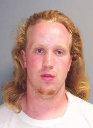 Charges lowered for city man accused in shooting