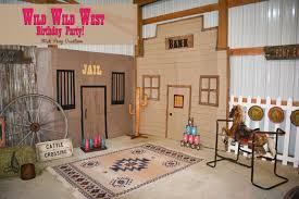Old barn windows, old wood planks and panels, wanted posters, wagon wheels, cacti, gingham curtains, bunting, cowboy boots, wild west sign, golden nugget saloon, large barn sacks and rats. Stick Pony Creations Wild Wild West Party Our Cowgirl S 1st Birthday Wild West Party Wild West Party Decorations Wild West Party Theme