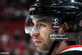 Derek Joslin of the Carolina Hurricanes fights with Matt Hendricks of...  News Photo