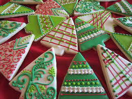 Wreaths and mistletoe are hung on the door. Whimsical Christmas Trees Cookie Connection