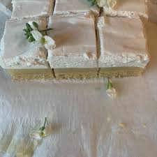 The first thing I look for when I am lucky enough to get to a fete, is a  good old fashioned Lemon Marshmallow Slice. You don't see it a lot these  days.