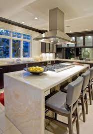 See more ideas about kitchen design, beautiful kitchens, home kitchens. All You Need To Know About The Waterfall Countertop Trend Kitchen Island Design Modern Kitchen Design Kitchen Design