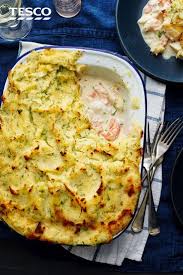 An Indulgent Treat This Fish Pie Recipe Includes Smoked Salmon Haddock And Prawns In A Creamy White Sauce Toppe White Sauce Recipes Tesco Real Food Fish Pie