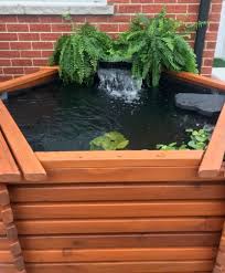 Concrete pond from above, top floor view down the side of a concrete building looking into a decorative water feature on the ground floor. 600 Gallon All Above Ground Pond Kit Kim S Ponds