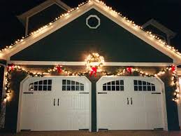 Garland Over Garage Doors Love It Garage Door Christmas Decorations Decorating With Christmas Lights Christmas Decorations Garland