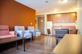 a view inside the shared lounge space in a pinecrest house unit ualberta house housing options home