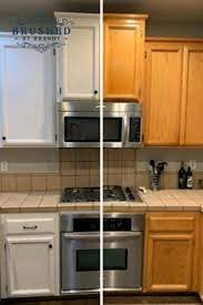 This go around we opted to try spraying them and it was a total time saver! Kitchen Cabinet Diy Painting Makeover Make Old Oak Cabinets New Again W Painting Kitchen Cabinets White Painting Kitchen Cabinets Chalk Paint Kitchen Cabinets