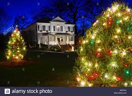 Red Green And White Christmas Lights Outdoor Christmas Trees Have Been Decorated With Red Green And White Lights And Shot Against A Brilliant Blue Sky Stock Photo Alamy