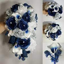 Make them look formal with added shimmery powder and iced piping or even cute dainty little roses or snowflakes. Navy Blue Silver White Rose Calla Lily Bridal Wedding Bouquet Bridal Wedding Bouquets
