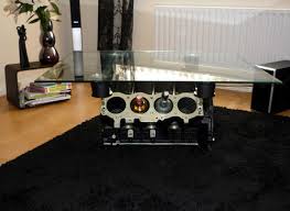 Check out this cool coffee table built from an old cadillac v8 engine block. V8 Engine Coffee Table With Cylinders As A Bottle Rack Funny Bizarre Amazing Pictures Videos