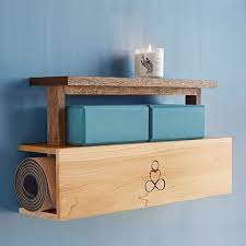I bought a wrapping paper container by rubbermaid (tall trash can height with a foot high lid with snaps on both sides). Uncommongoods Yoga Mat Storage And Display Shelf Review